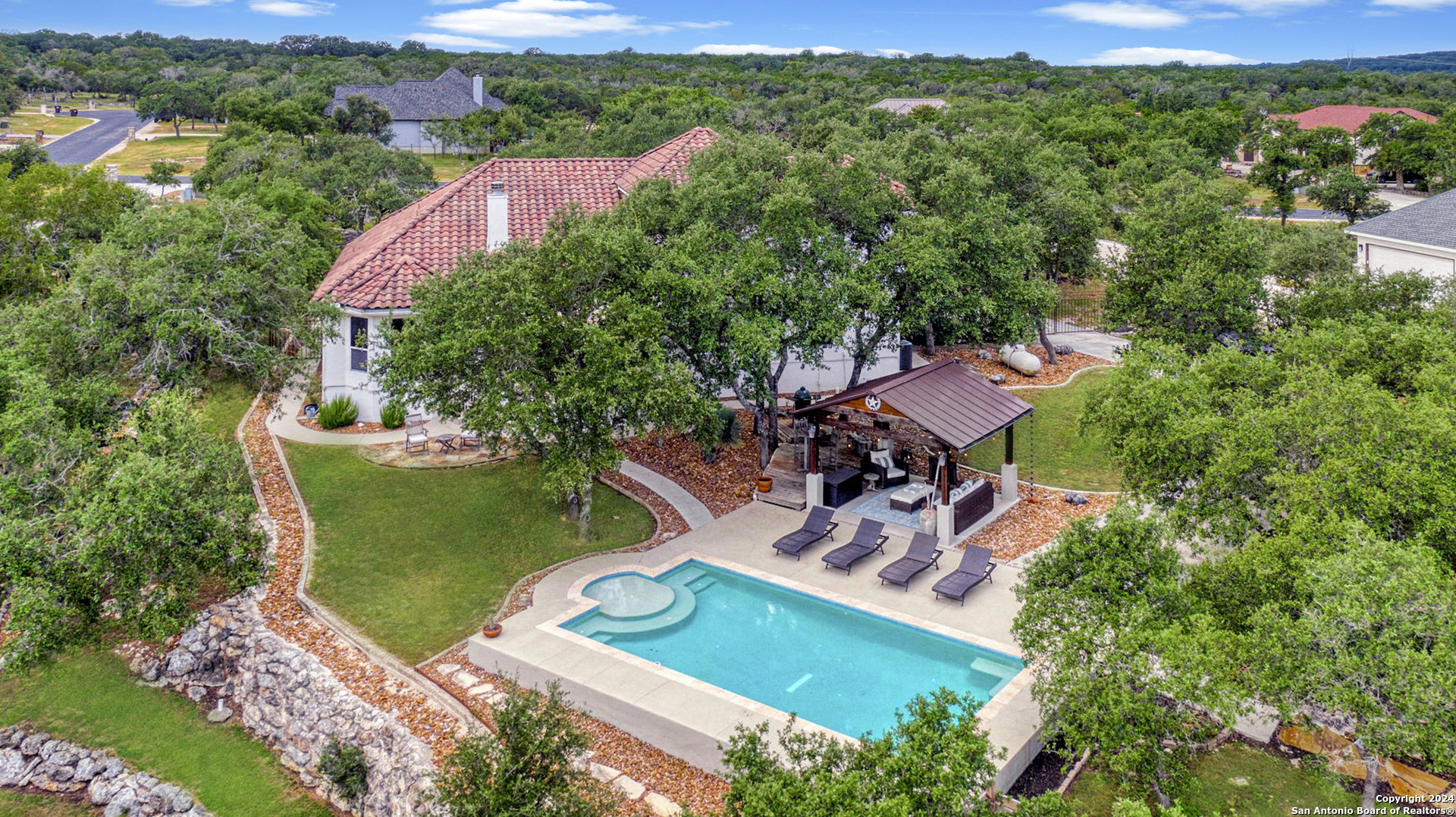 an aerial view of a house with garden space lake view and mountain view