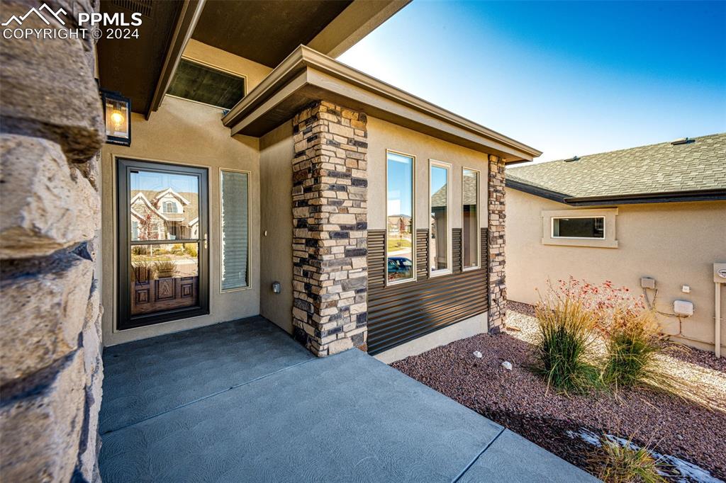 Doorway to property with a patio