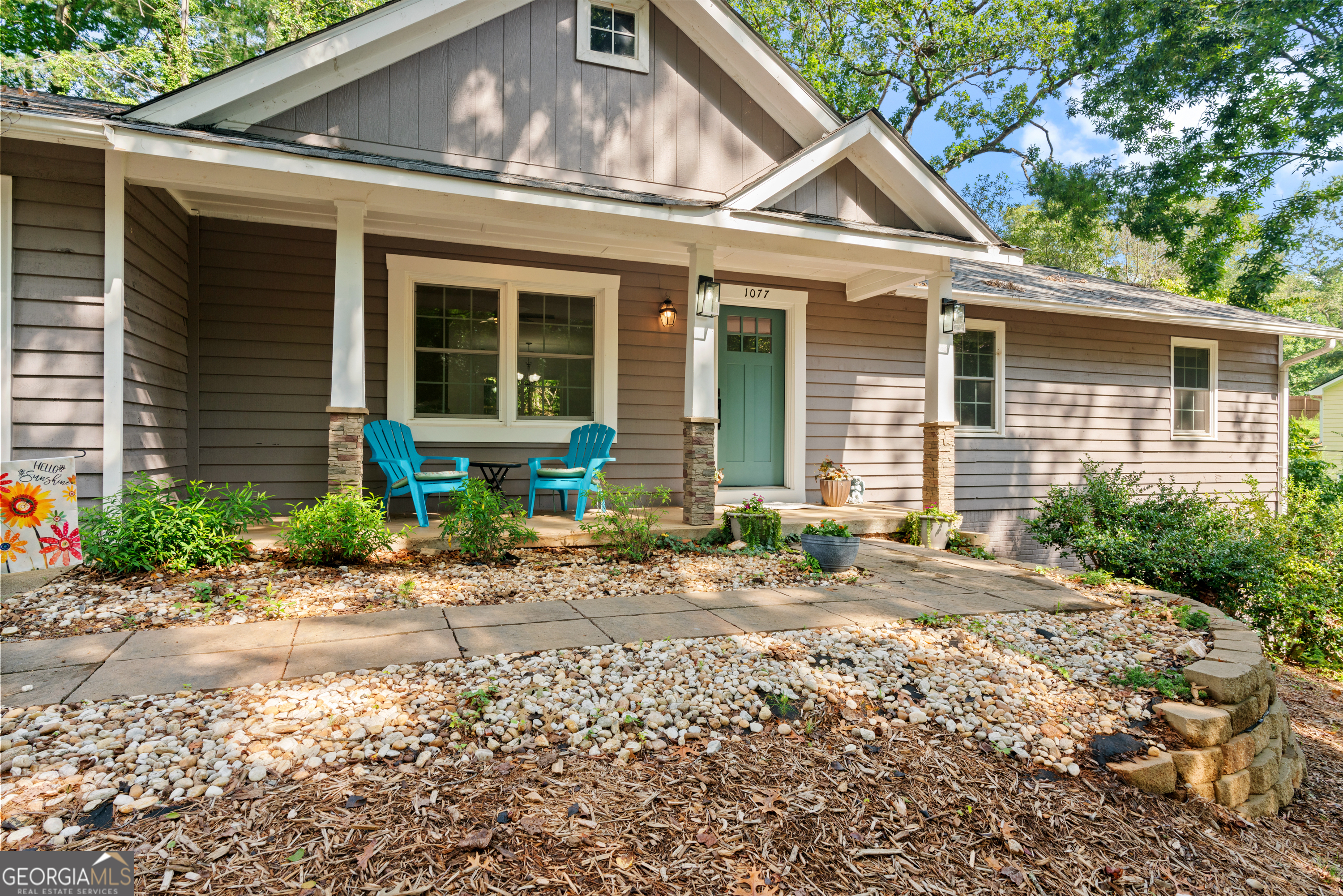 a front view of a house with garden