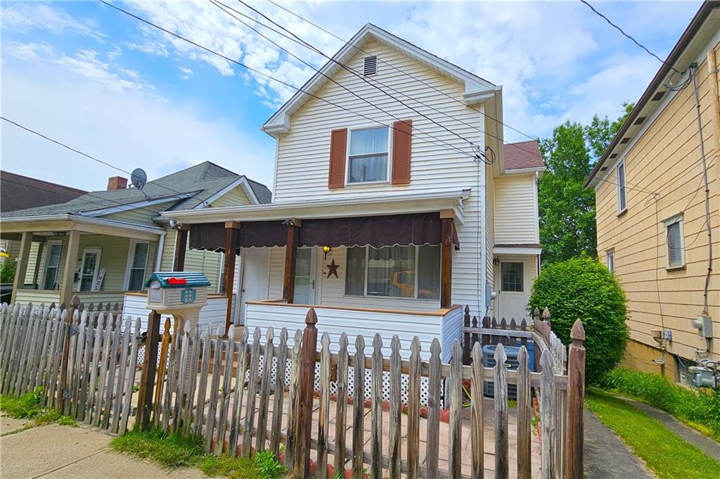 a front view of a house with a porch