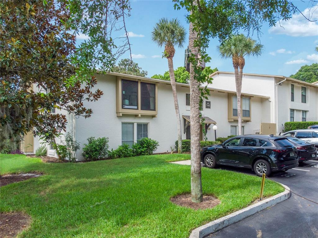 Spacious second floor END-UNIT condo with LAKE ORIENTA VIEWS in Altamonte Springs with NEW WINDOWS, a NEW A/C, VAULTED WOOD SLAT CEILINGS, WOOD BURNING FIREPLACE and LAKE ACCESS? Yes, please!