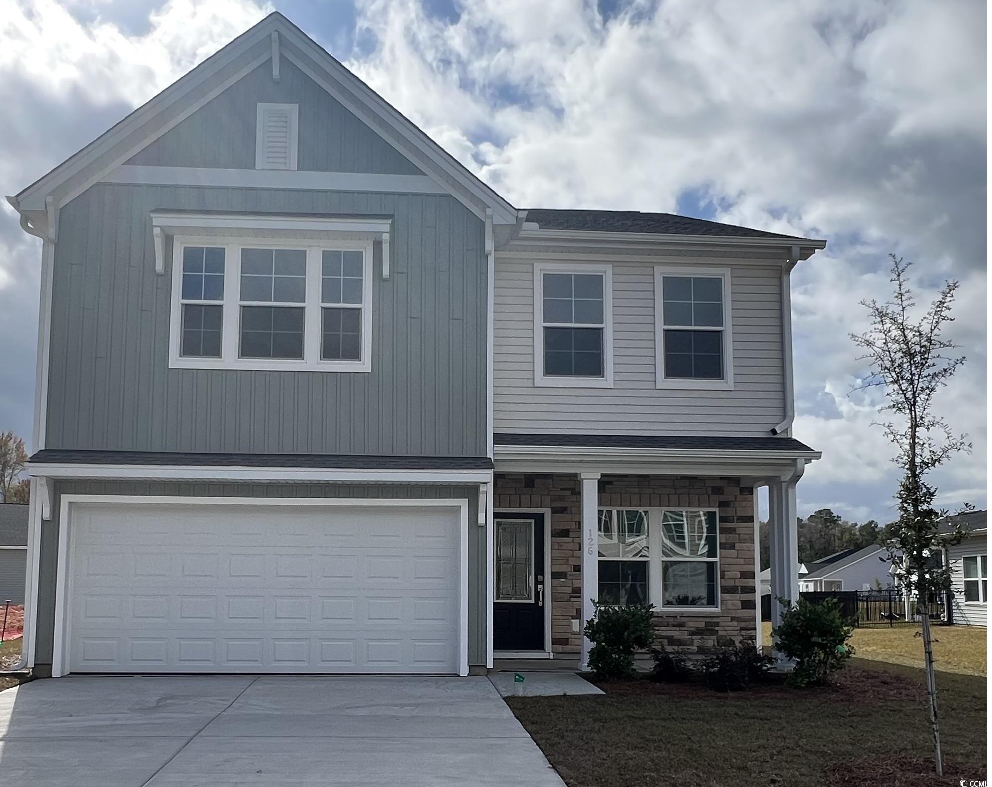 View of front of house with a garage