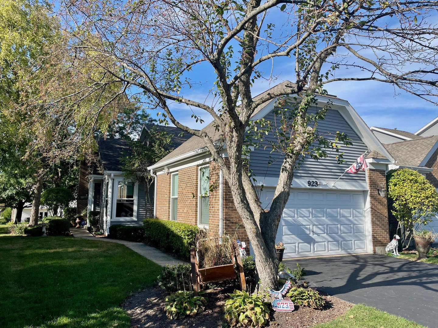 a front view of a house with garden