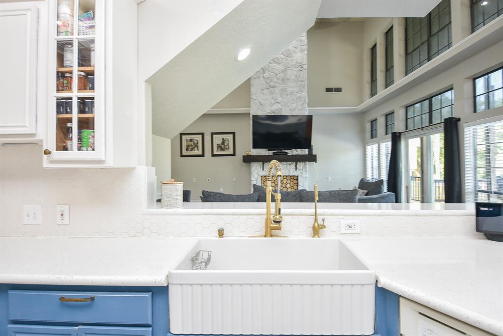 a bathroom with a sink a bathtub and a mirror