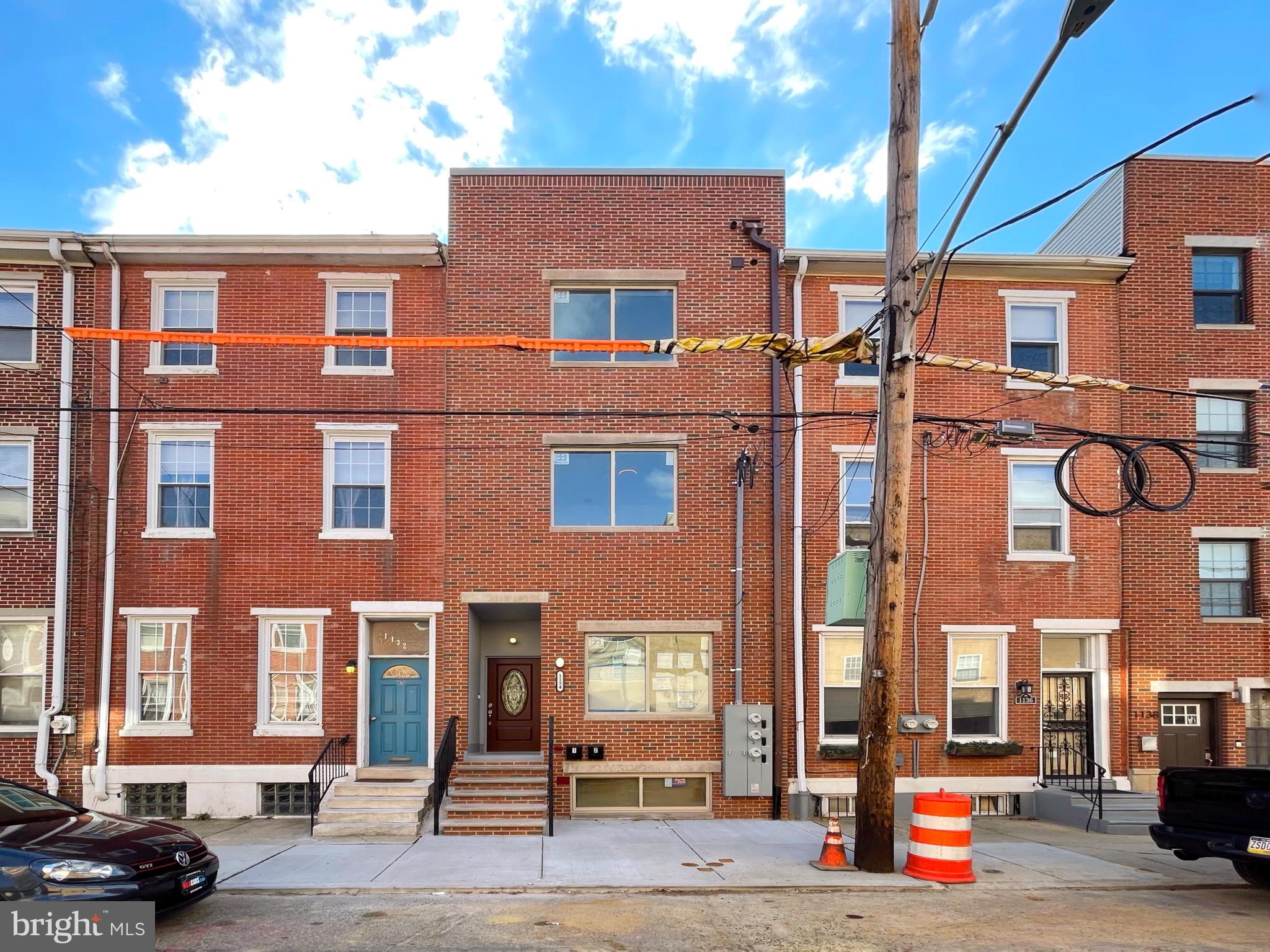 a view of a brick building with many windows