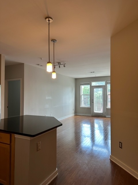 a view of livingroom and kitchen with hardwood floor