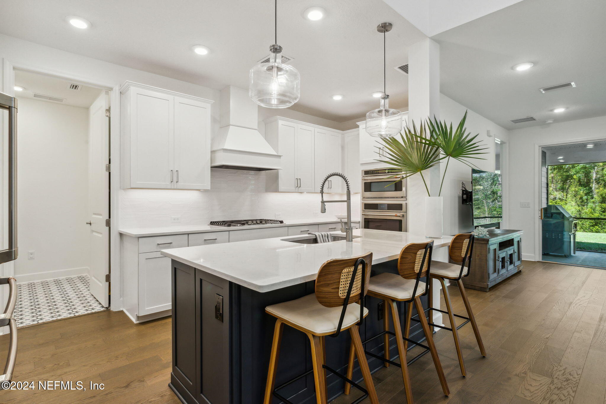 a kitchen with a table and chairs in it