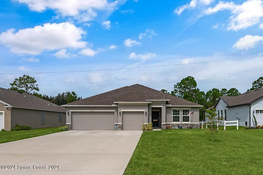 front view of a house with a yard