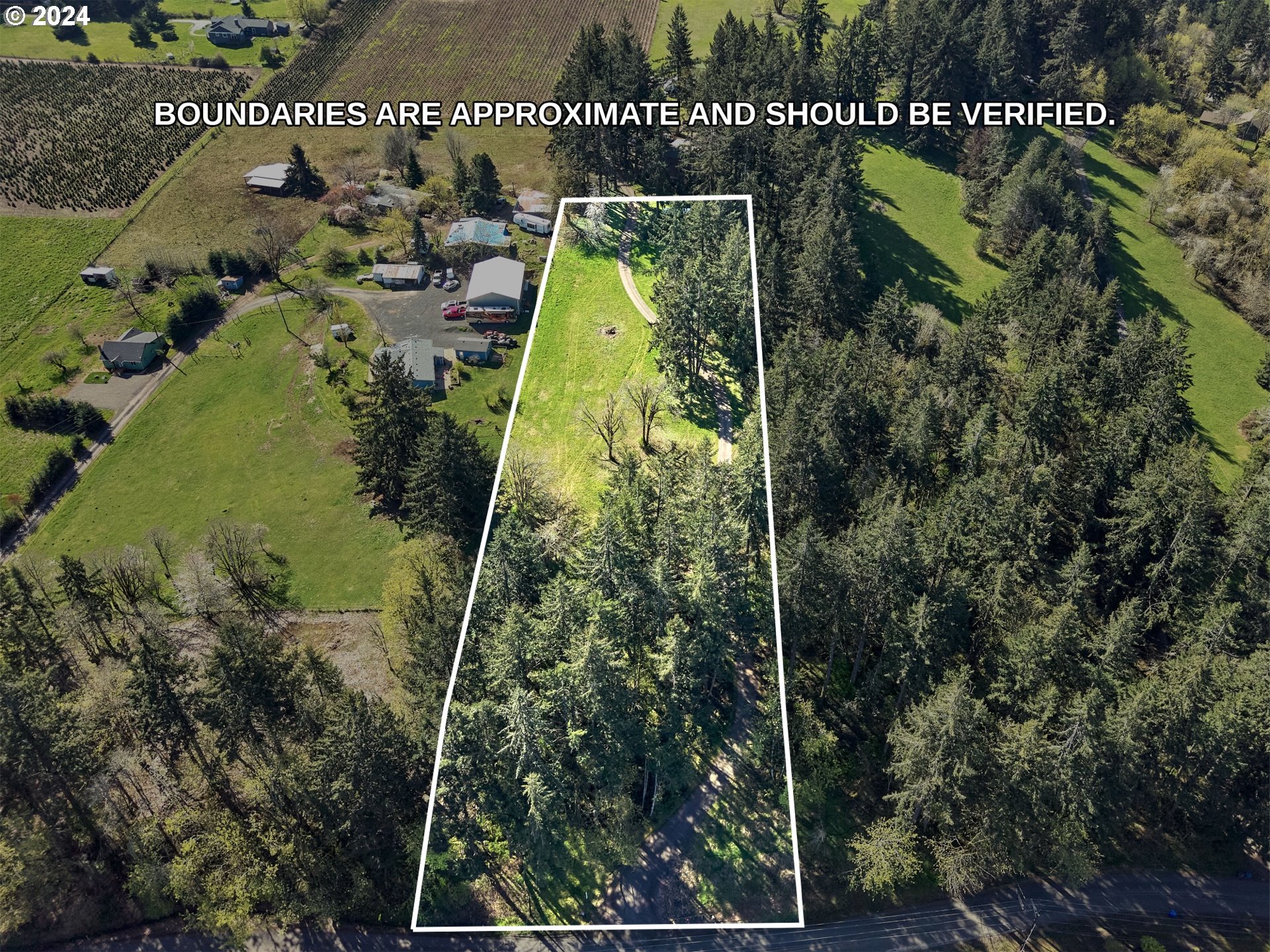 an aerial view of a residential houses with outdoor space and swimming pool