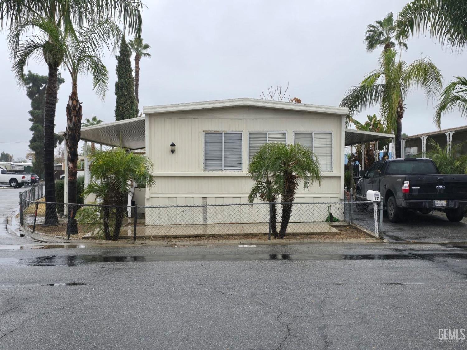 a view of a house with a yard and garage