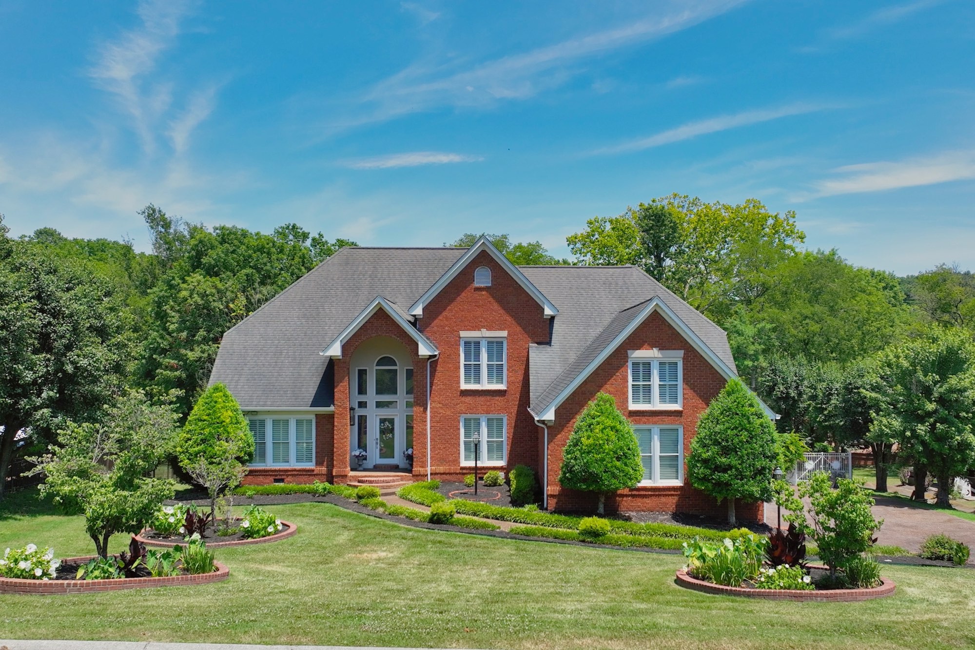 a front view of a house with a yard