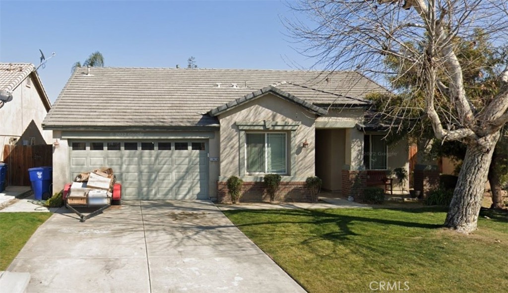 a front view of house with outdoor seating