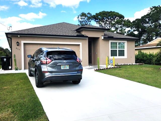 a view of house with yard