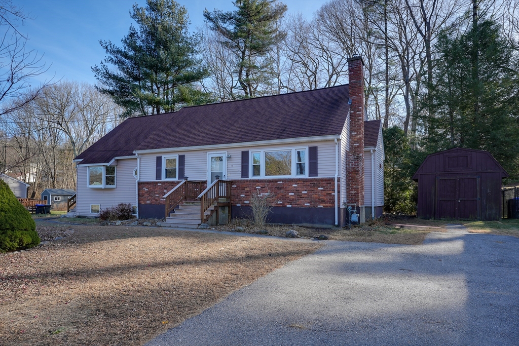 a house that has a tree in front of it