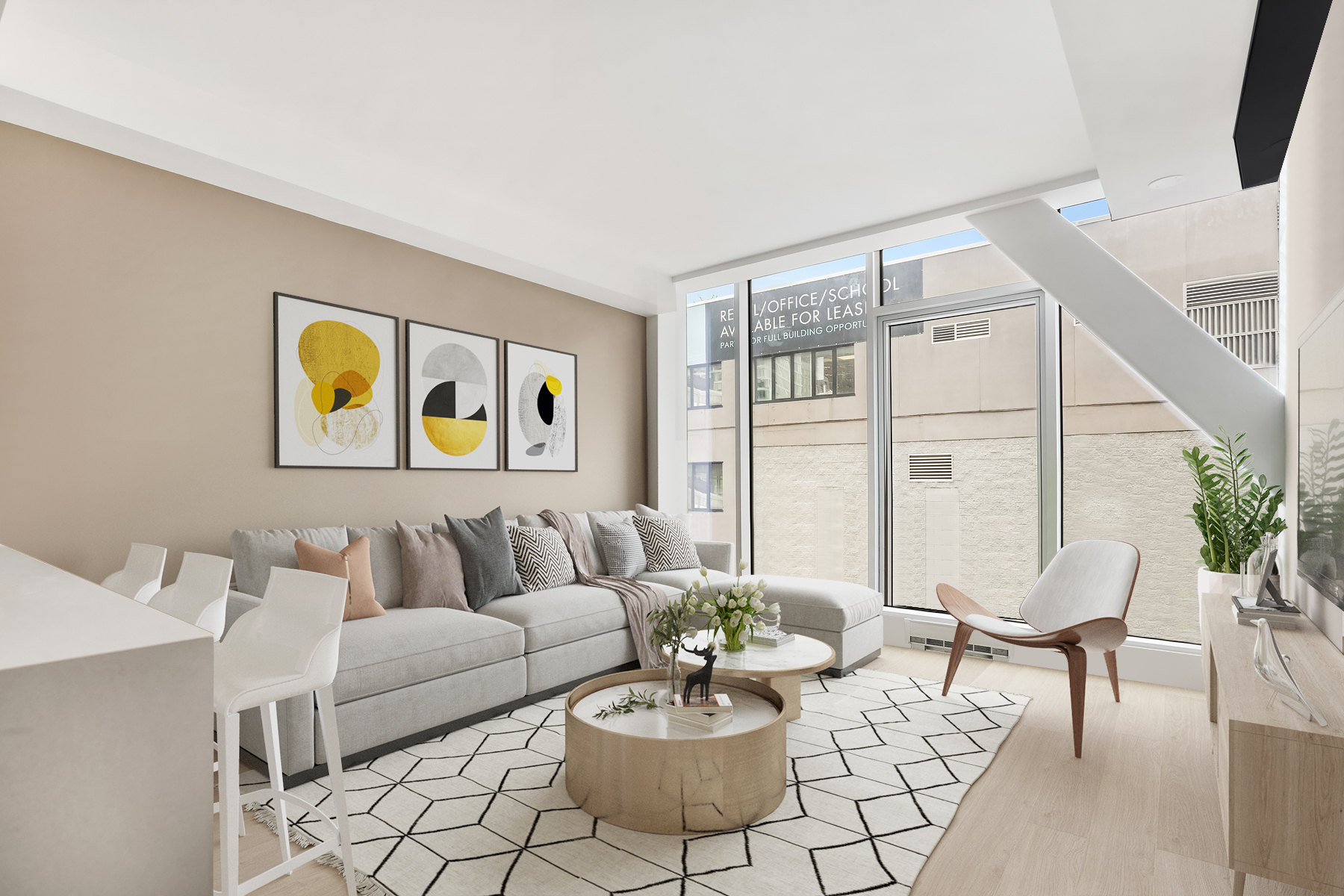 a living room with furniture and a potted plant