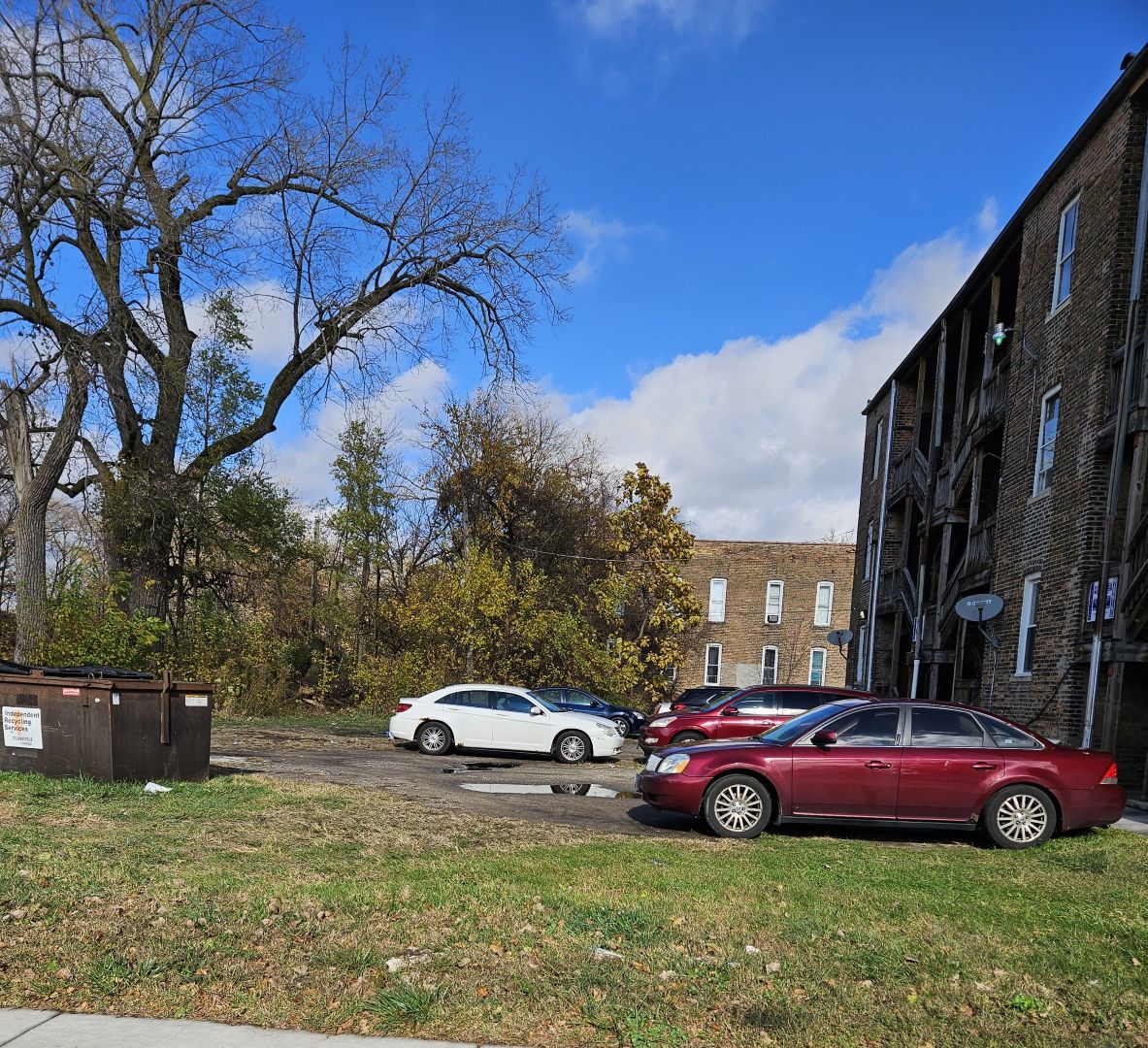 a view of street with parked cars