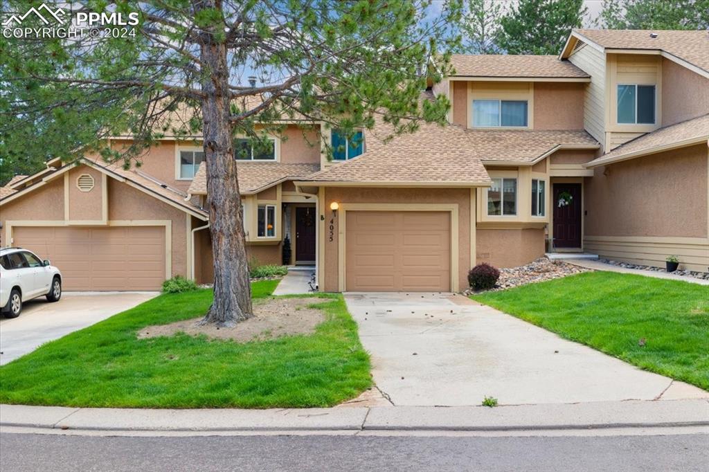 a view of a yard in front view of a house