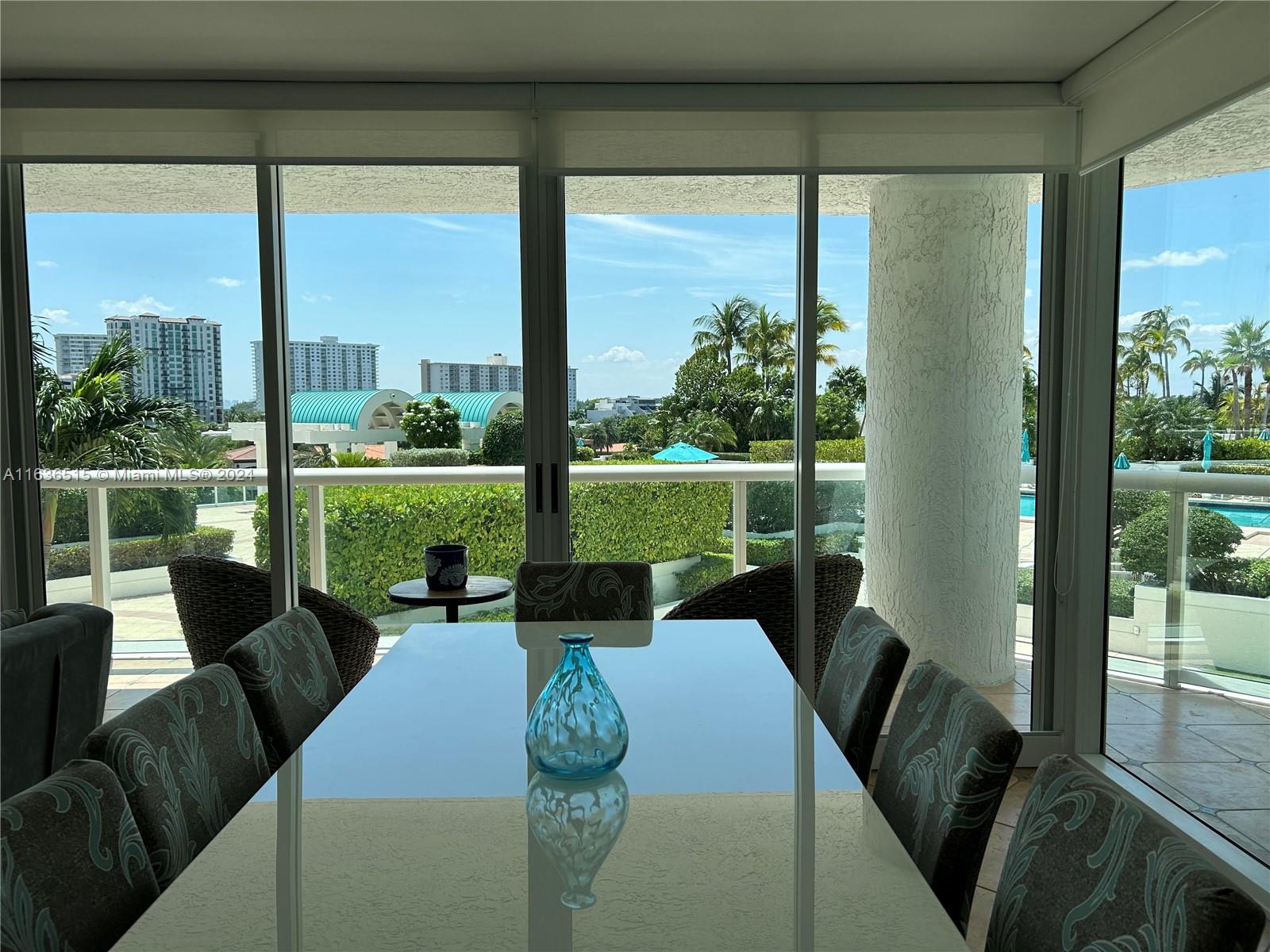 a view of a city from a living room filled with furniture