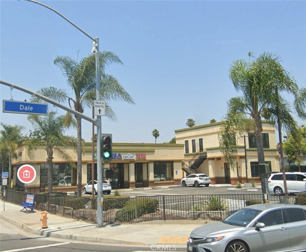 a front view of a building with street view