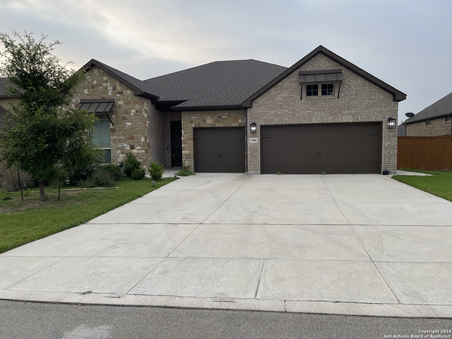 a front view of a house with yard