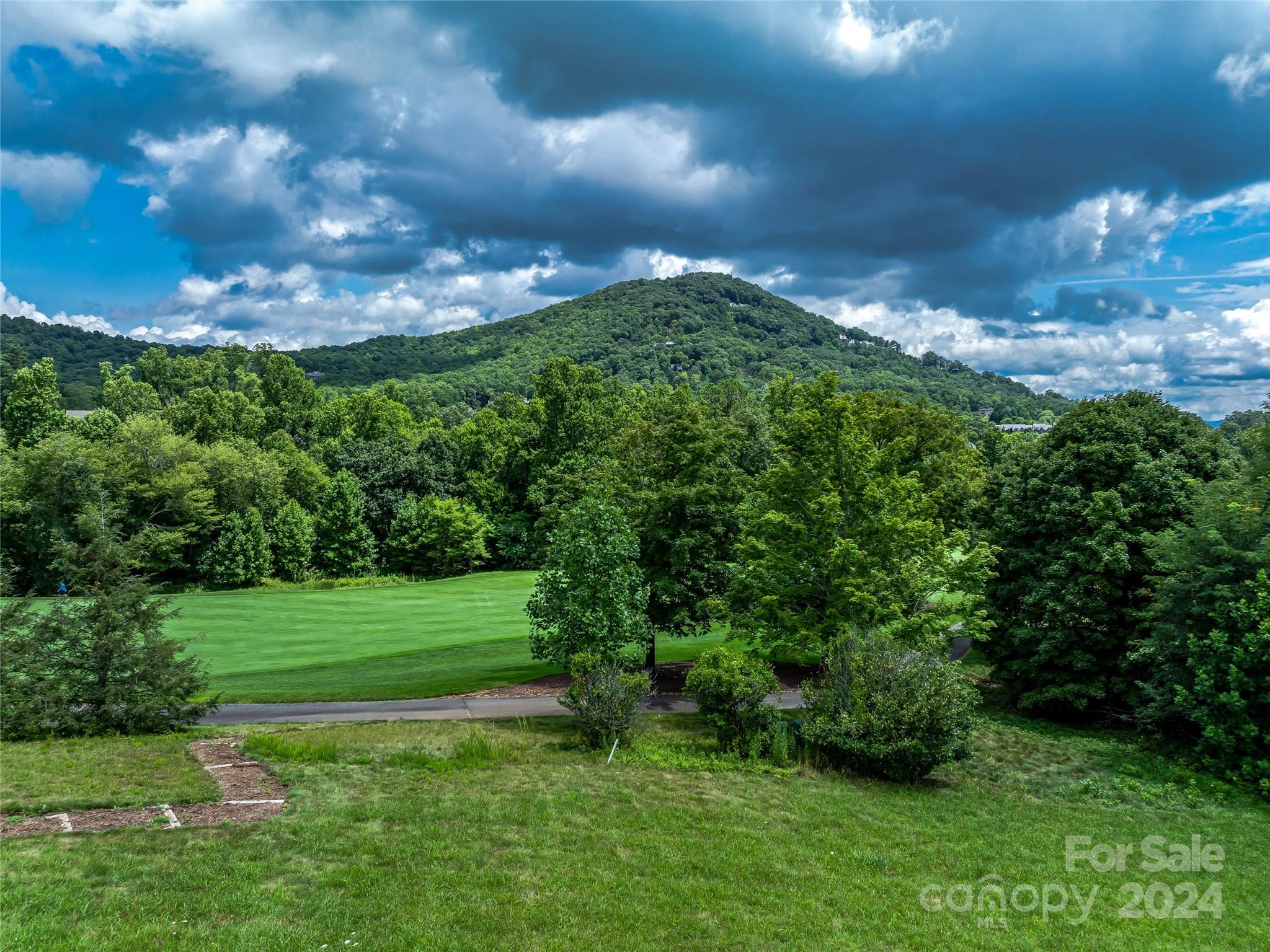 a view of a golf course with a garden