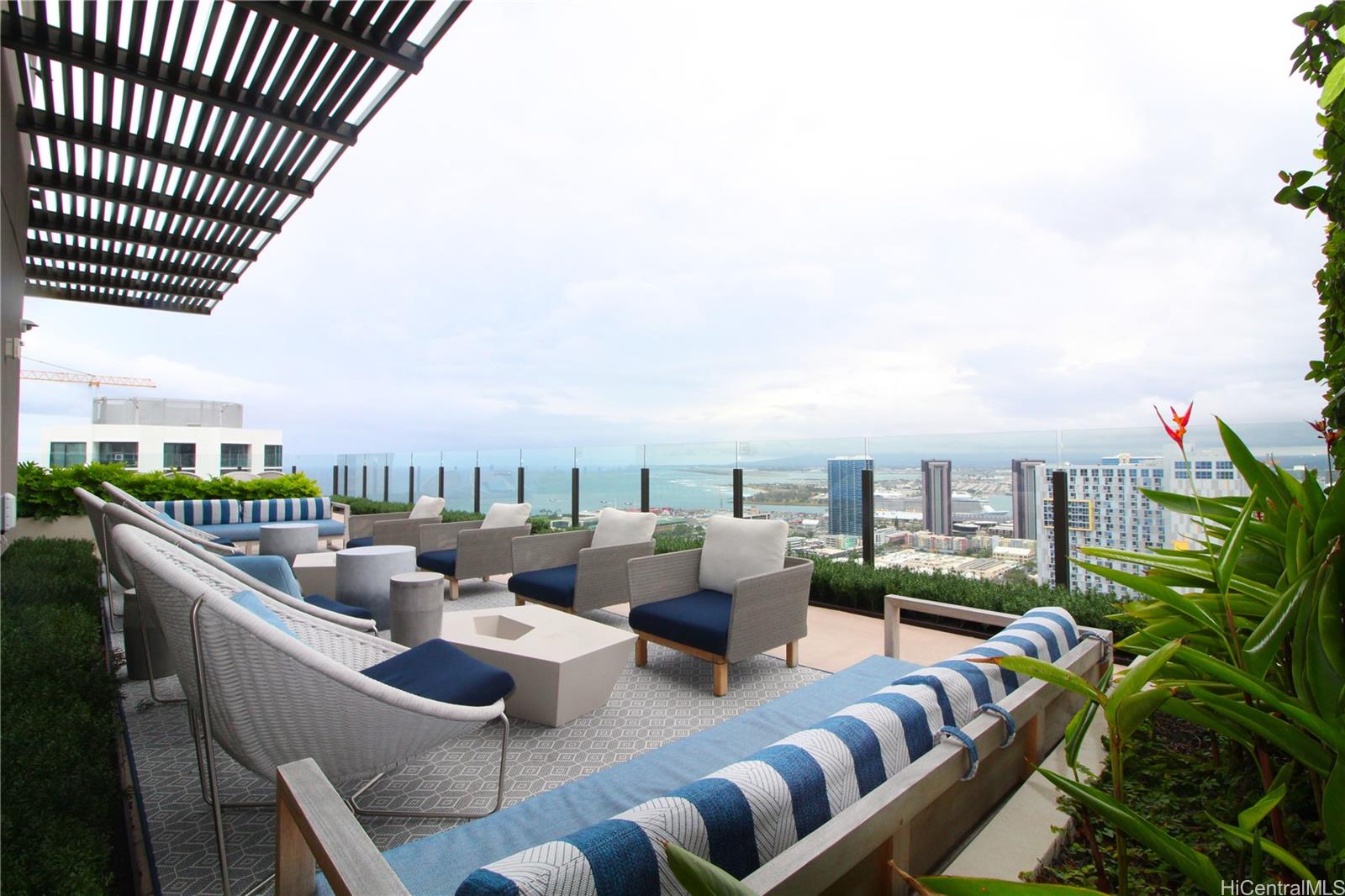 a terrace with outdoor seating and city view