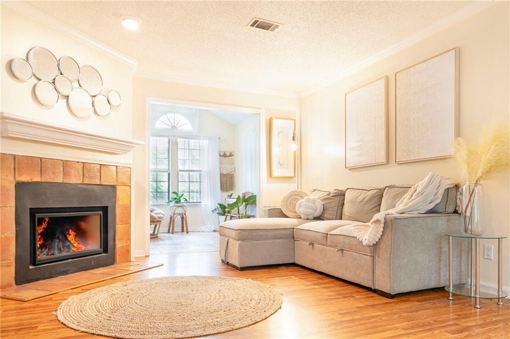 a living room with furniture and a fireplace