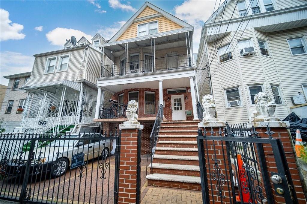 a front view of a house with a porch