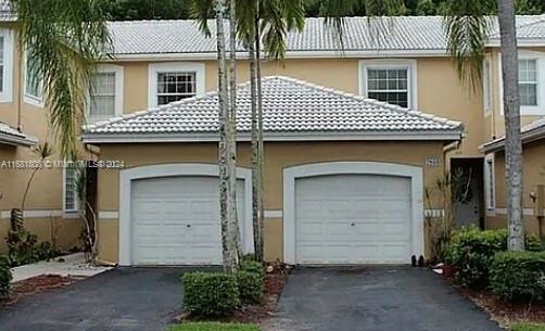 a front view of a house with a garage