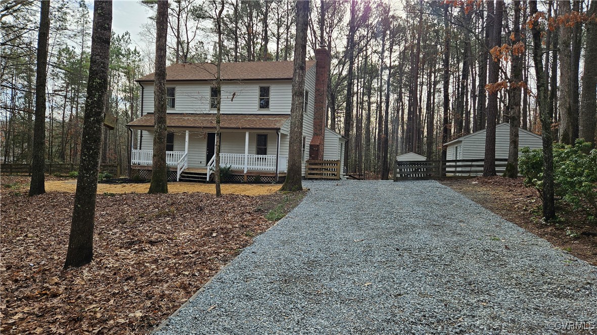 View of front property featuring covered porch