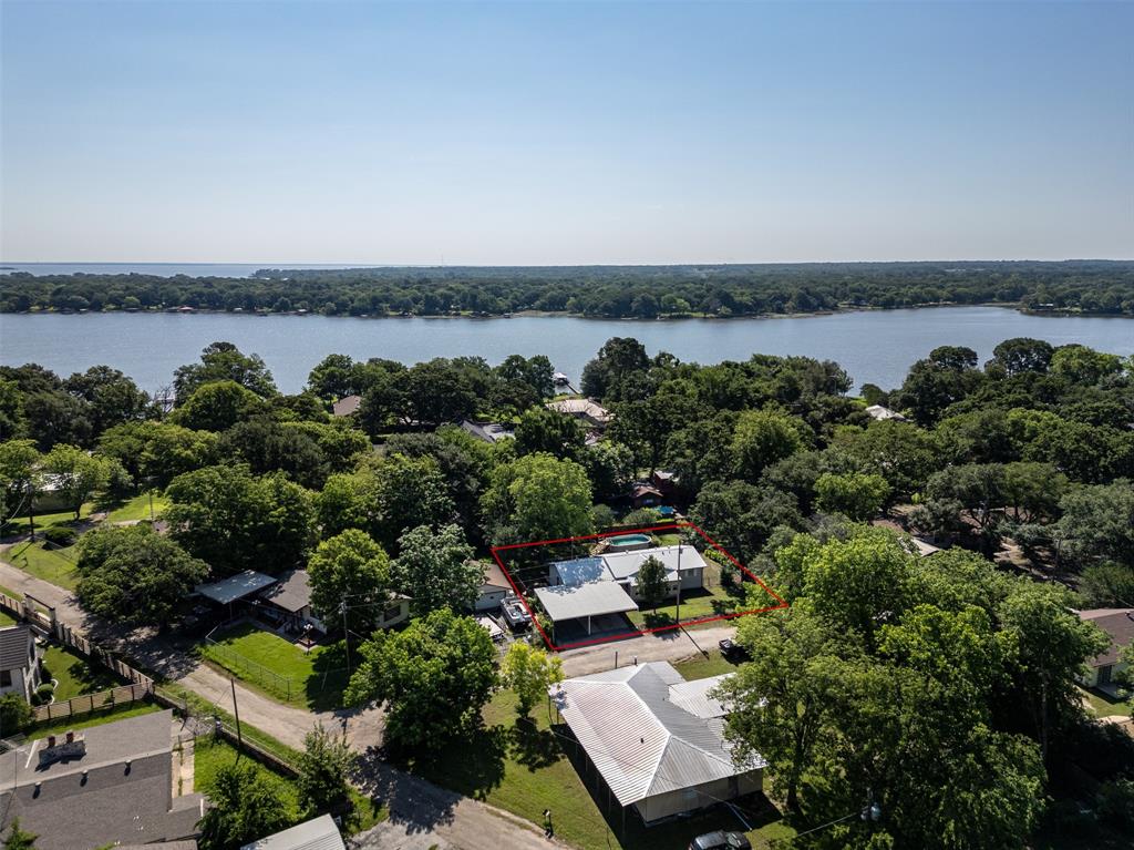 an aerial view of a house with a lake view