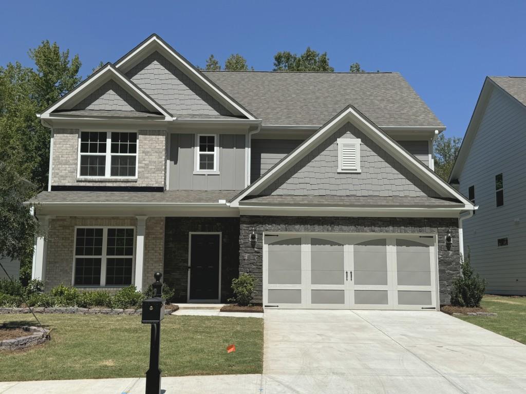 front view of a house with a yard