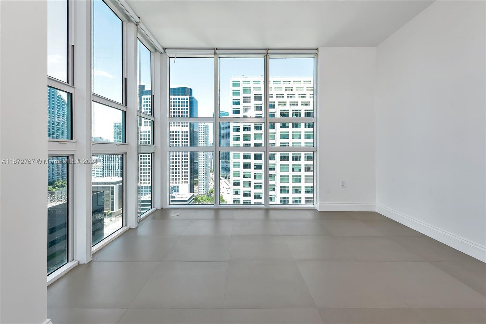 a view of an empty room with a balcony