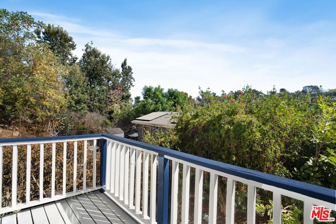 a balcony with an outdoor space