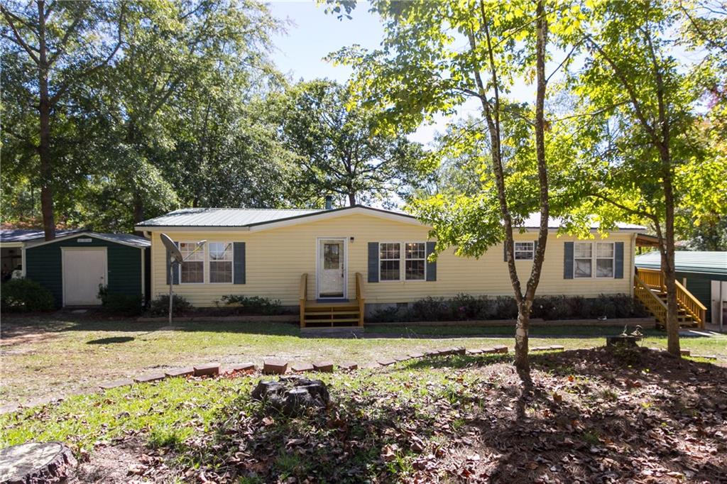 a house with trees in the background