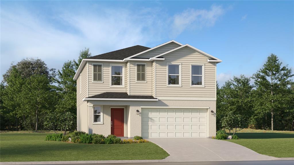 a front view of a house with a yard and garage