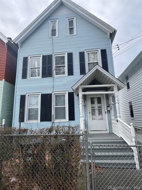 a front view of a house with yard