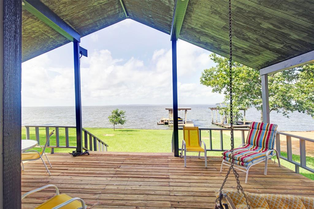 a view of a balcony with lake view and a ocean view