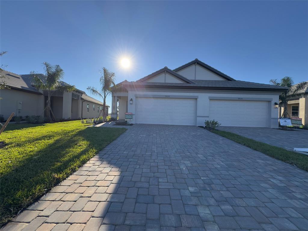 a view of a front of a house with a yard