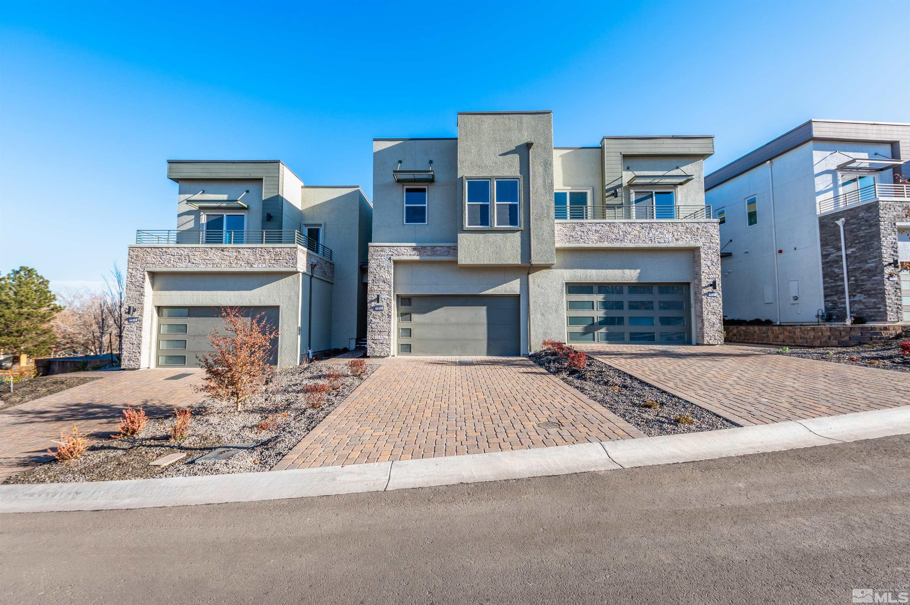 a front view of a house with yard