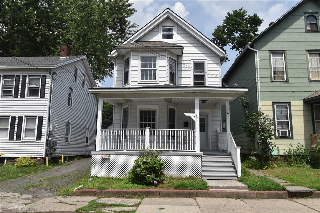 Charming two story home with front porch perfect for sitting and relaxing!