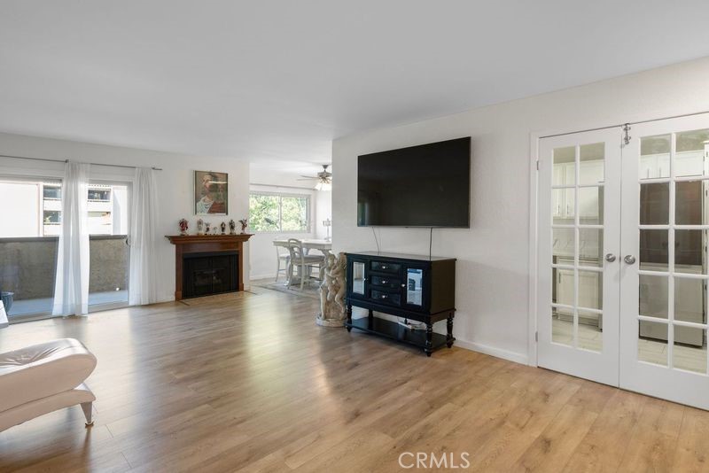 a living room with furniture a fireplace a flat screen tv and a fireplace