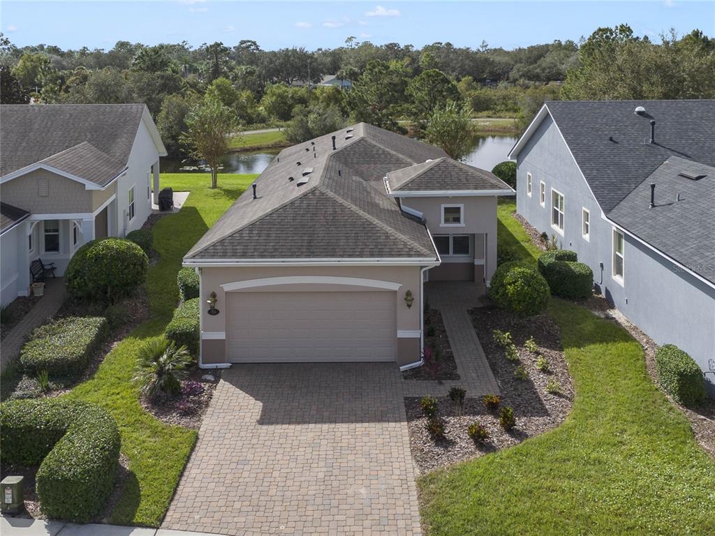 Aerial front view of home w/ water & conservation area view