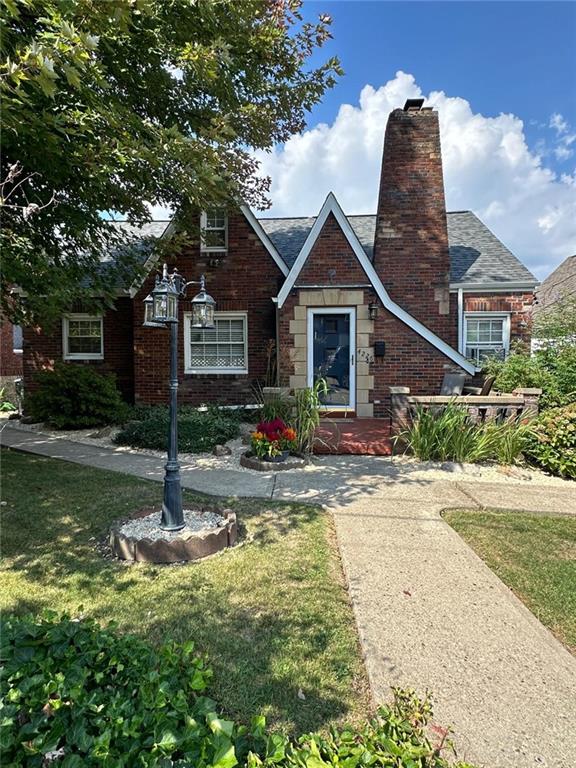 a front view of a house with garden