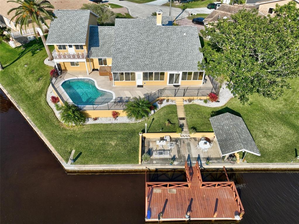 an aerial view of a house with outdoor space swimming pool and outdoor seating