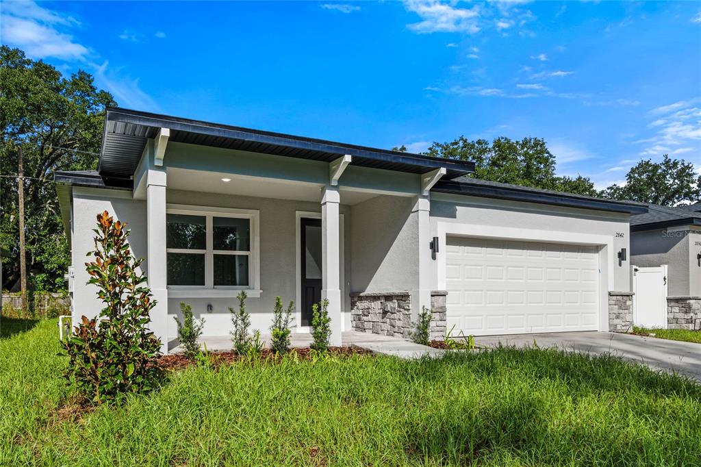 front view of a house with a yard