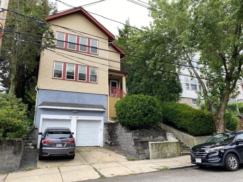 a car parked in front of a house