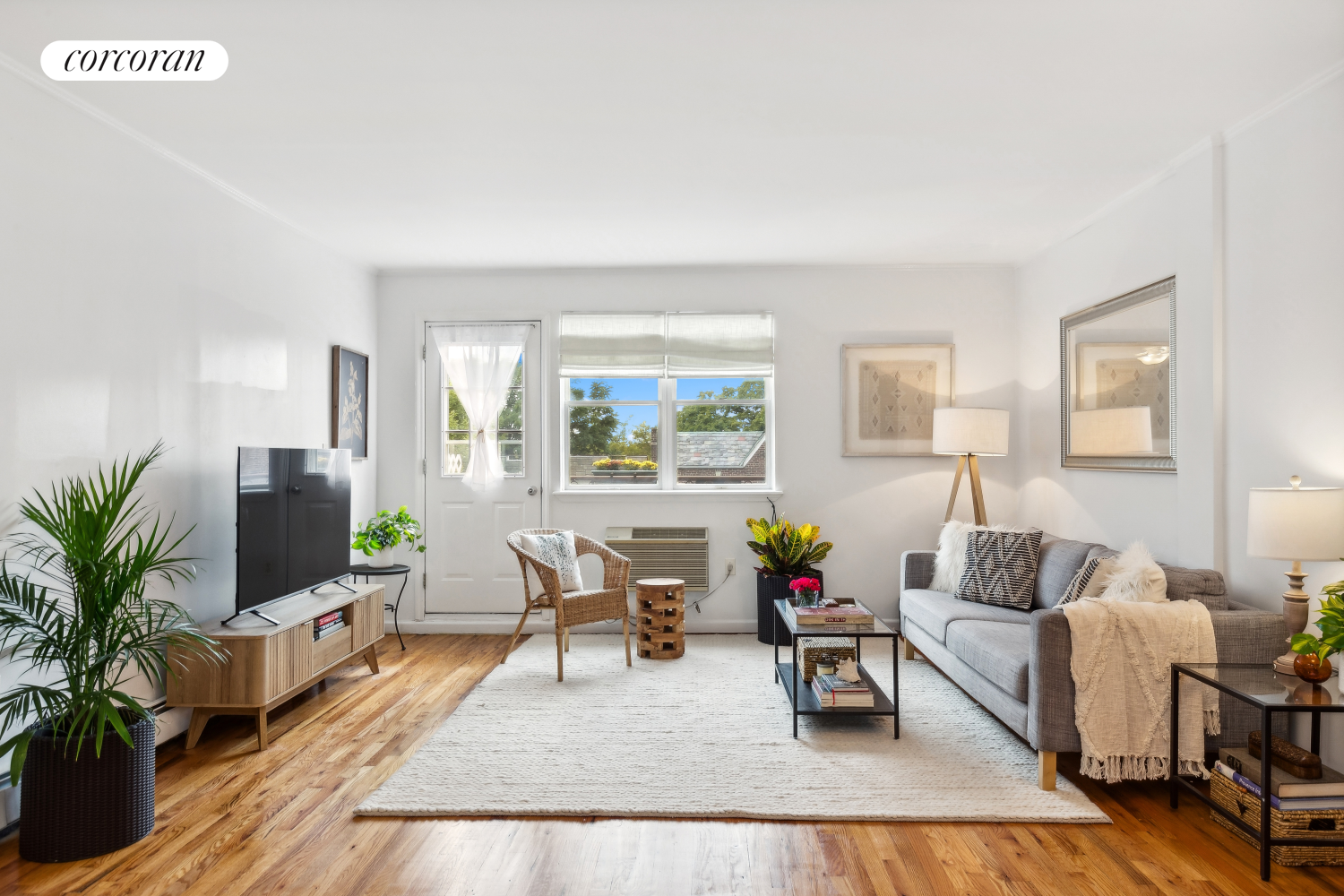 a living room with furniture and a flat screen tv