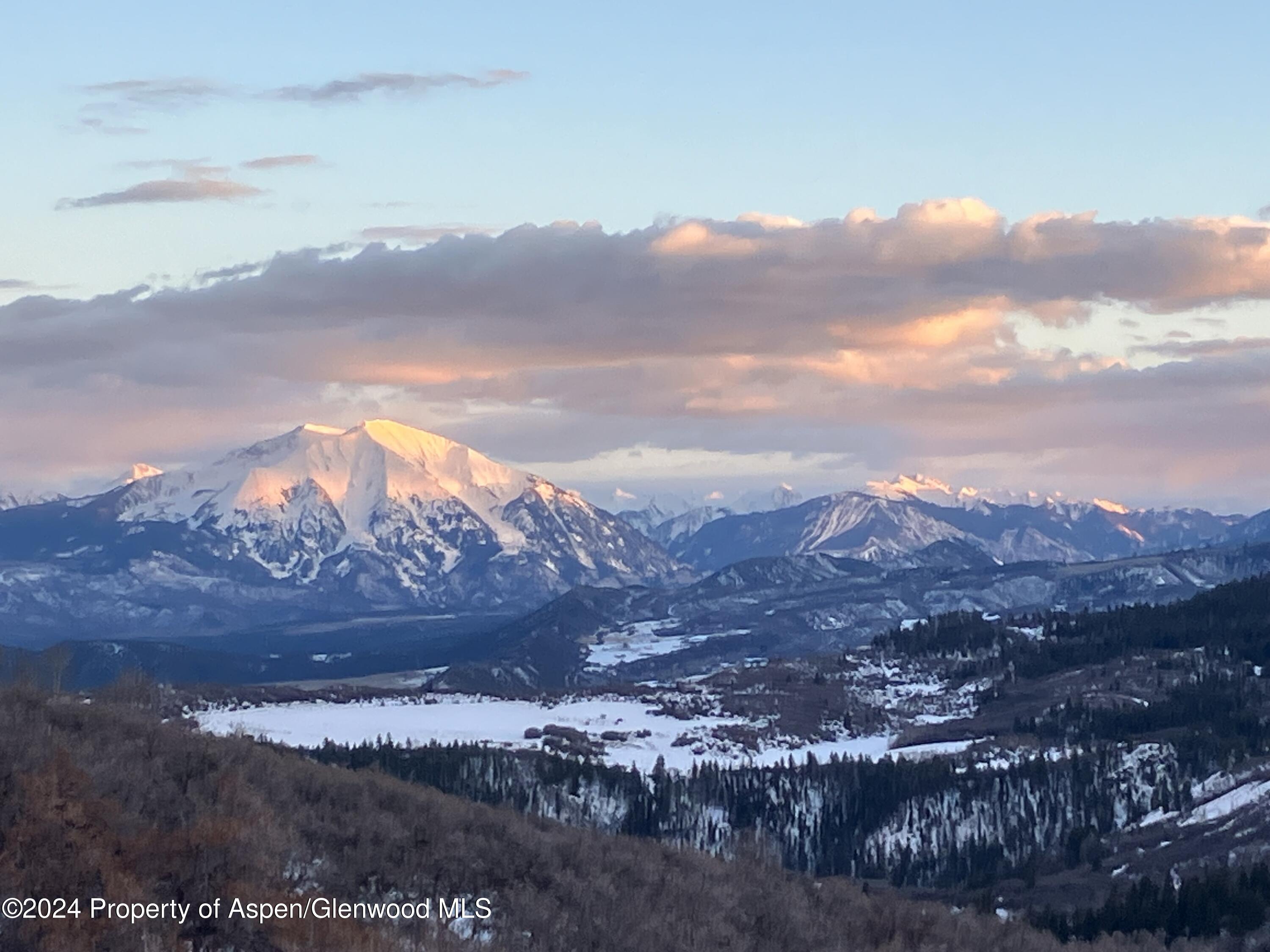 a view of mountain and sunset