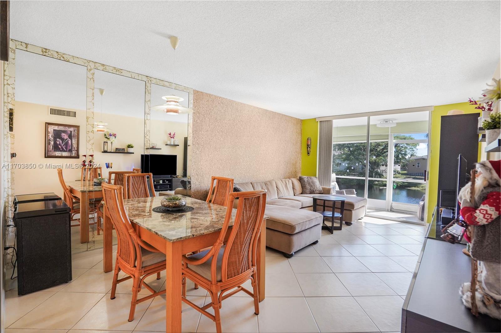 a view of a dining room with furniture window and outside view